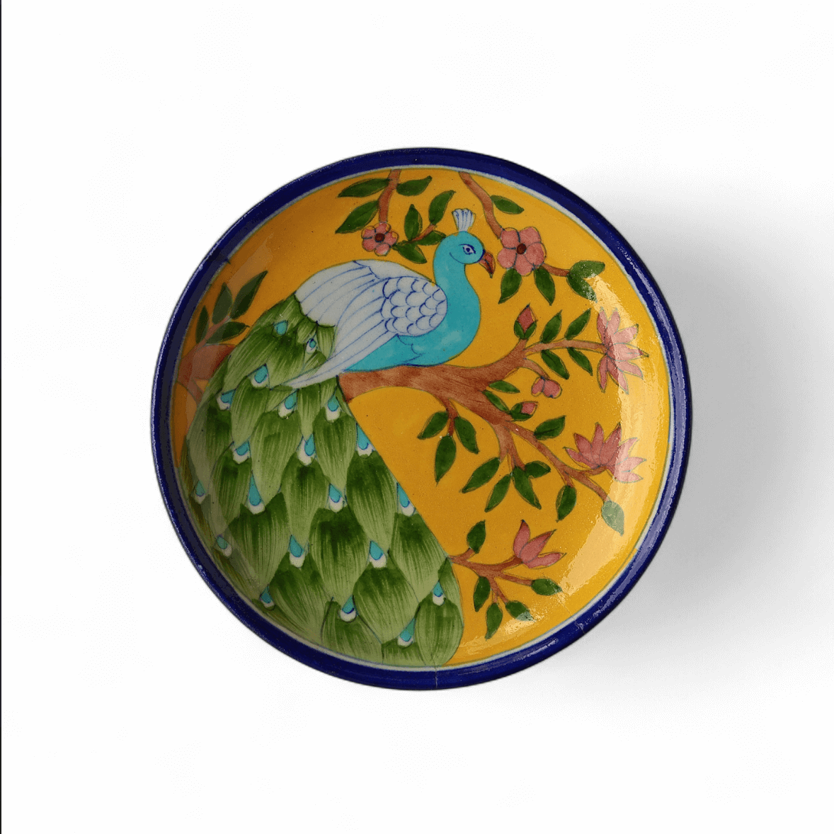 Blue pottery plate with peacock motif