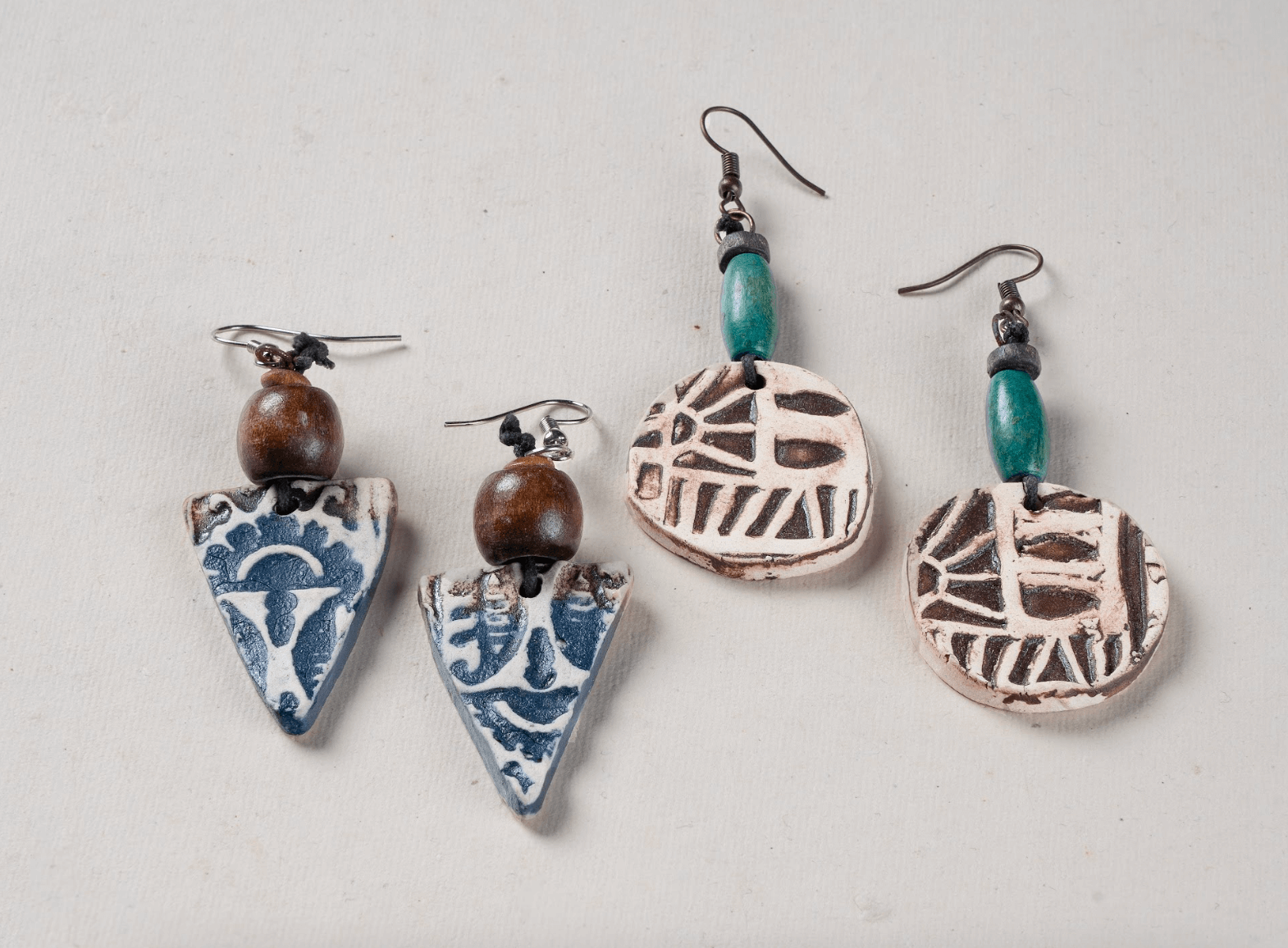 Terracotta earrings with carved motifs